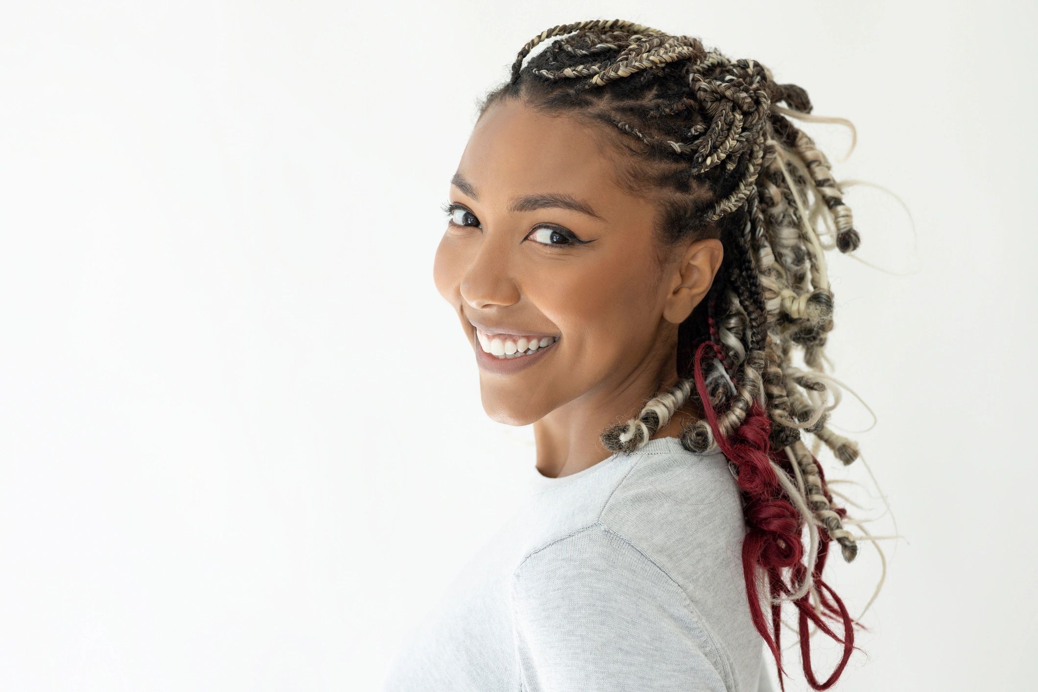 Diverse group of people smiling with different braided hairstyles